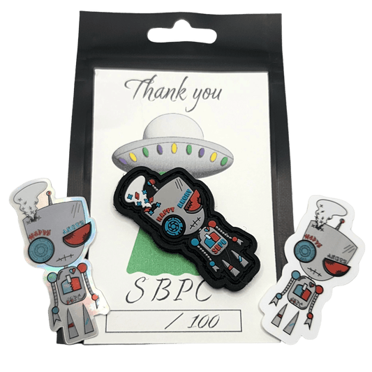 Bipolar Bot mood swing PVC patch with stickers and numbered art card, showcasing two distinct robot expressions.
