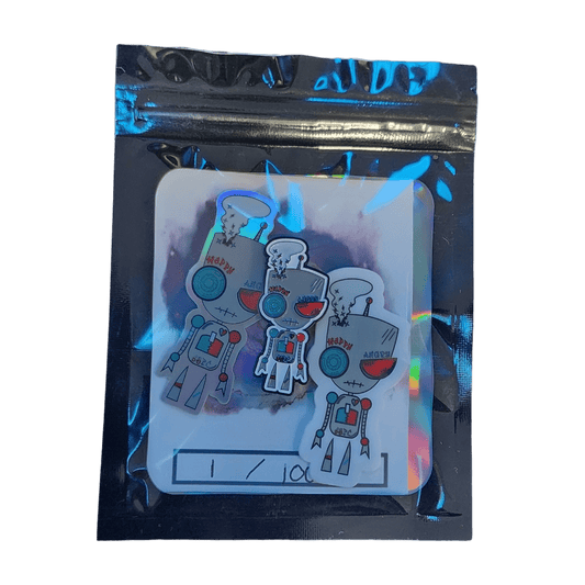 Bipolar Bot Soft Enamel Pin in a holographic mylar bag.