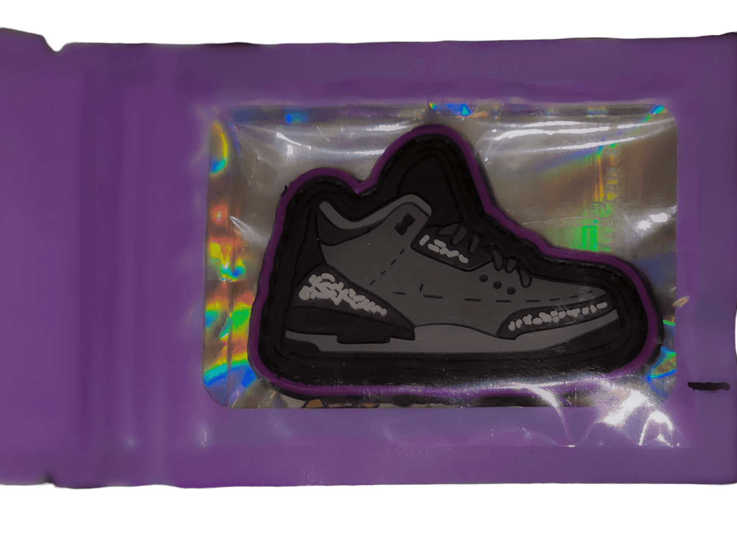 Wolf Grey V0 - PVC Patch - PVC Patch - SBP-WG-V0-PVC-001 - Sticky Back Patch Company - An image of the 'Wolf Grey V0' patch inside a holographic mylar bag.