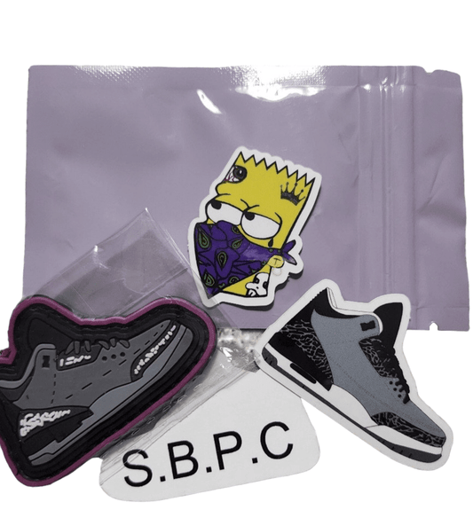 Wolf Grey V0 - PVC Patch - PVC Patch - SBP-WG-V0-PVC-001 - Sticky Back Patch Company - An image of the 'Wolf Grey V0' product, featuring a sticker of the 'Yellow Menace,, and two shoe stickers.