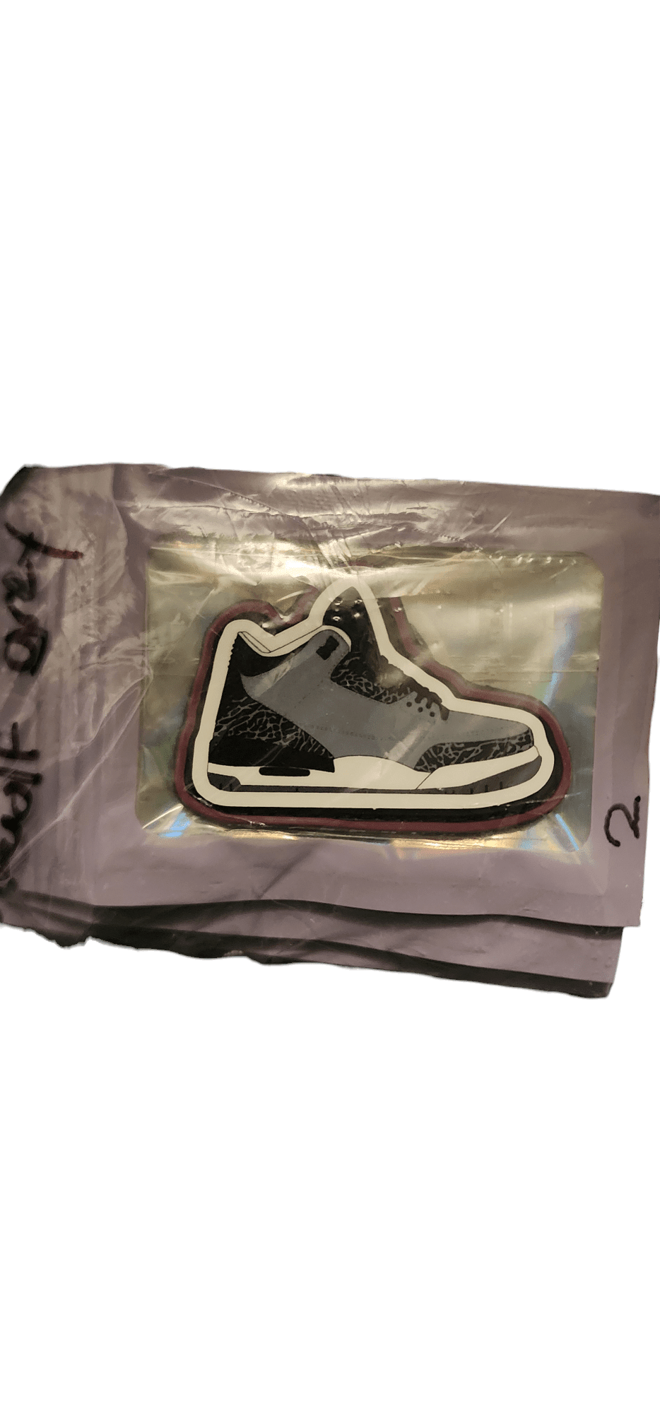 Wolf Grey V0 - PVC Patch - PVC Patch - SBP-WG-V0-PVC-001 - Sticky Back Patch Company - A 'Wolf Grey V0' patch inside a holographic mylar bag.